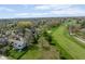 An aerial view showcases the home's location and surrounding neighborhood near the golf course at 797 Crossbridge Ct, Avon, IN 46123