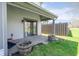 Covered back porch with sliding door entry and two weathered wood barrel planters at 797 Crossbridge Ct, Avon, IN 46123