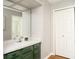 Bathroom vanity with green cabinets, white countertops, and neutral wall color at 797 Crossbridge Ct, Avon, IN 46123