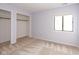Neutral carpet and walls in this bedroom with walk-in closet and natural light at 797 Crossbridge Ct, Avon, IN 46123