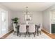 Cozy dining room with a dark wood table and upholstered chairs at 797 Crossbridge Ct, Avon, IN 46123