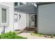 Inviting entrance features a covered doorway and sliding glass door leading to a white-sided home at 797 Crossbridge Ct, Avon, IN 46123