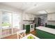 Updated kitchen with white and green cabinets, and a stainless steel refrigerator at 797 Crossbridge Ct, Avon, IN 46123