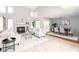 Spacious living room featuring a fireplace, large windows, and an open dining area at 797 Crossbridge Ct, Avon, IN 46123
