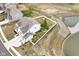 Aerial view of a property with a large fenced backyard, pond, and well-maintained landscaping at 836 Grassy Branch Dr, Indianapolis, IN 46239