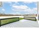 View of the deck and backyard with a white fence, offering privacy and a pleasant outdoor space at 836 Grassy Branch Dr, Indianapolis, IN 46239