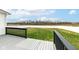 View of the deck and backyard with a white fence, offering privacy and a pleasant outdoor space at 836 Grassy Branch Dr, Indianapolis, IN 46239