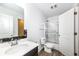 Bathroom featuring white walls, a bathtub, and a dark vanity with white countertops at 836 Grassy Branch Dr, Indianapolis, IN 46239