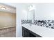 Bathroom featuring white vanity, decorative backsplash, and view into an adjoining room at 836 Grassy Branch Dr, Indianapolis, IN 46239