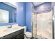 Bathroom featuring modern finishes, including a glass-enclosed shower and a dark vanity with a white sink at 836 Grassy Branch Dr, Indianapolis, IN 46239