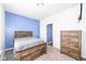Bedroom featuring carpet, a modern bed frame, a wood dresser, and natural light from the window at 836 Grassy Branch Dr, Indianapolis, IN 46239