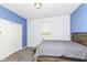 Bedroom featuring carpet, a modern bed frame, a large closet, and natural light from the window at 836 Grassy Branch Dr, Indianapolis, IN 46239