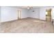 Large room with neutral carpet, bright lighting, and natural light from multiple windows at 836 Grassy Branch Dr, Indianapolis, IN 46239