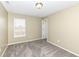 Bedroom with neutral walls, carpeted floors, a window and a glimpse into an adjoining room at 836 Grassy Branch Dr, Indianapolis, IN 46239