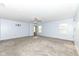 Spacious bedroom with light blue walls, neutral carpet, ceiling fan, and natural light at 836 Grassy Branch Dr, Indianapolis, IN 46239