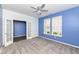 Inviting bedroom with French doors, plush carpet, a modern ceiling fan, and natural light from two windows at 836 Grassy Branch Dr, Indianapolis, IN 46239