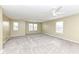 Large bonus room with neutral carpet, bright lighting, and natural light from multiple windows at 836 Grassy Branch Dr, Indianapolis, IN 46239