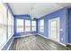Bright dining area with vaulted ceilings, chandelier, and backyard access at 836 Grassy Branch Dr, Indianapolis, IN 46239