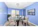 Bright dining room featuring a glass table, chandelier and modern decor at 836 Grassy Branch Dr, Indianapolis, IN 46239