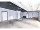 Spacious garage with gray walls, painted ceiling, and ample lighting at 836 Grassy Branch Dr, Indianapolis, IN 46239