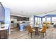 Kitchen with island and barstool seating flows into a dining area at 836 Grassy Branch Dr, Indianapolis, IN 46239