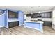 Modern kitchen with stainless steel appliances, island, and white countertops at 836 Grassy Branch Dr, Indianapolis, IN 46239
