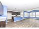 Open-concept kitchen with island, gray cabinets, and breakfast nook at 836 Grassy Branch Dr, Indianapolis, IN 46239