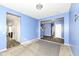 Inviting living room with blue accent wall and contrasting flooring at 836 Grassy Branch Dr, Indianapolis, IN 46239