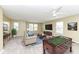 Inviting living room with bright lighting, comfortable seating, a TV, and a foosball table at 836 Grassy Branch Dr, Indianapolis, IN 46239
