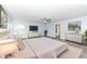 This main bedroom boasts bright natural light and is staged with designer furniture at 836 Grassy Branch Dr, Indianapolis, IN 46239