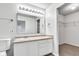 Well-lit bathroom featuring a large mirror, vanity, and ample cabinet space at 8808 Hosta Way, Indianapolis, IN 46113