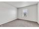 Carpeted bedroom featuring a bright window and neutral color palette at 8808 Hosta Way, Indianapolis, IN 46113