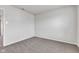 Neutral bedroom showing carpet, electrical outlets and entrance to another room at 8808 Hosta Way, Indianapolis, IN 46113