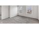 Bright bedroom with two large windows offering natural light and neutral carpeting at 8808 Hosta Way, Indianapolis, IN 46113