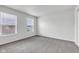 Bright bedroom with two large windows offering natural light and neutral carpeting at 8808 Hosta Way, Indianapolis, IN 46113