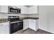 Stainless steel appliances and white cabinets complete this modern kitchen at 8808 Hosta Way, Indianapolis, IN 46113
