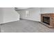 Living room with fireplace, neutral carpet, and a window at 8808 Hosta Way, Indianapolis, IN 46113