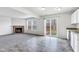 Bright living room with fireplace and sliding glass doors leading to outdoor deck at 8808 Hosta Way, Indianapolis, IN 46113