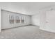 Spacious living room filled with natural light from three large windows at 8808 Hosta Way, Indianapolis, IN 46113