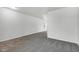 Long room featuring neutral walls and carpet and vinyl flooring, providing a blank canvas for customization at 8808 Hosta Way, Indianapolis, IN 46113