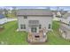 Aerial view of backyard featuring a raised deck with a grill and outdoor seating area at 894 Woodgate Ln, Greenwood, IN 46143