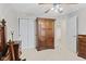 Bedroom features a closet, paneled doors, and warm-toned walls creating a cozy and inviting atmosphere at 894 Woodgate Ln, Greenwood, IN 46143