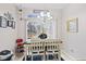 Bright dining area with a table, white chairs, and a view to the outside at 894 Woodgate Ln, Greenwood, IN 46143