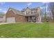 Beautiful two-story home featuring a spacious front yard and a two-car attached garage at 894 Woodgate Ln, Greenwood, IN 46143