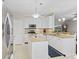 Bright kitchen boasting white cabinetry, granite countertops, stainless steel appliances, and a center island at 894 Woodgate Ln, Greenwood, IN 46143