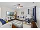 Comfortable living room featuring a wooden floor, ceiling fan, and modern furnishings at 894 Woodgate Ln, Greenwood, IN 46143