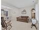 Comfortable living room with a cozy seating area, dining set, and natural light at 894 Woodgate Ln, Greenwood, IN 46143