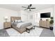Serene bedroom features a king bed, neutral color palette, and comfortable decor creating a relaxing retreat at 902 N Anderson St, Elwood, IN 46036