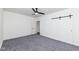 Spacious bedroom with a modern ceiling fan, plush carpet, and walk-in closet, offering comfort and style at 902 N Anderson St, Elwood, IN 46036