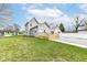 Charming gray two story house with new wood front porch at 902 N Anderson St, Elwood, IN 46036